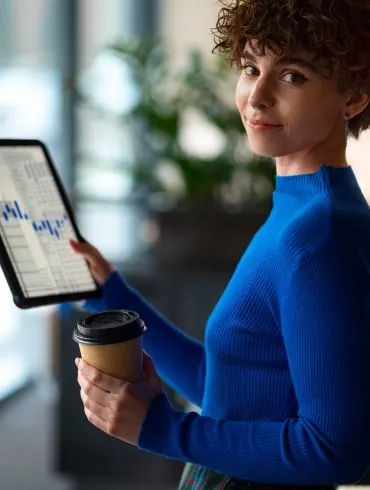 Woman reviewing an invoice on a tablet